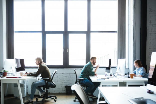 young-colleagues-work-office-using-computers_171337-6718